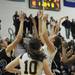 Saline and Woodhaven players reach for a rebound on Tuesday, March 5. Daniel Brenner I AnnArbor.com